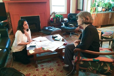 Tina interviewing a former patient of her experience.