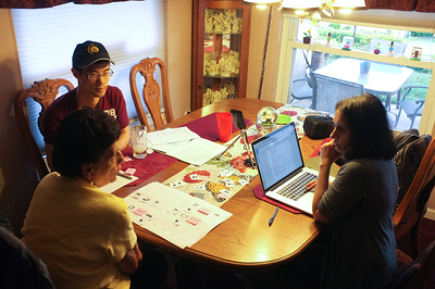 Jay and Tina listening to a study participant during a paper prototyping session.