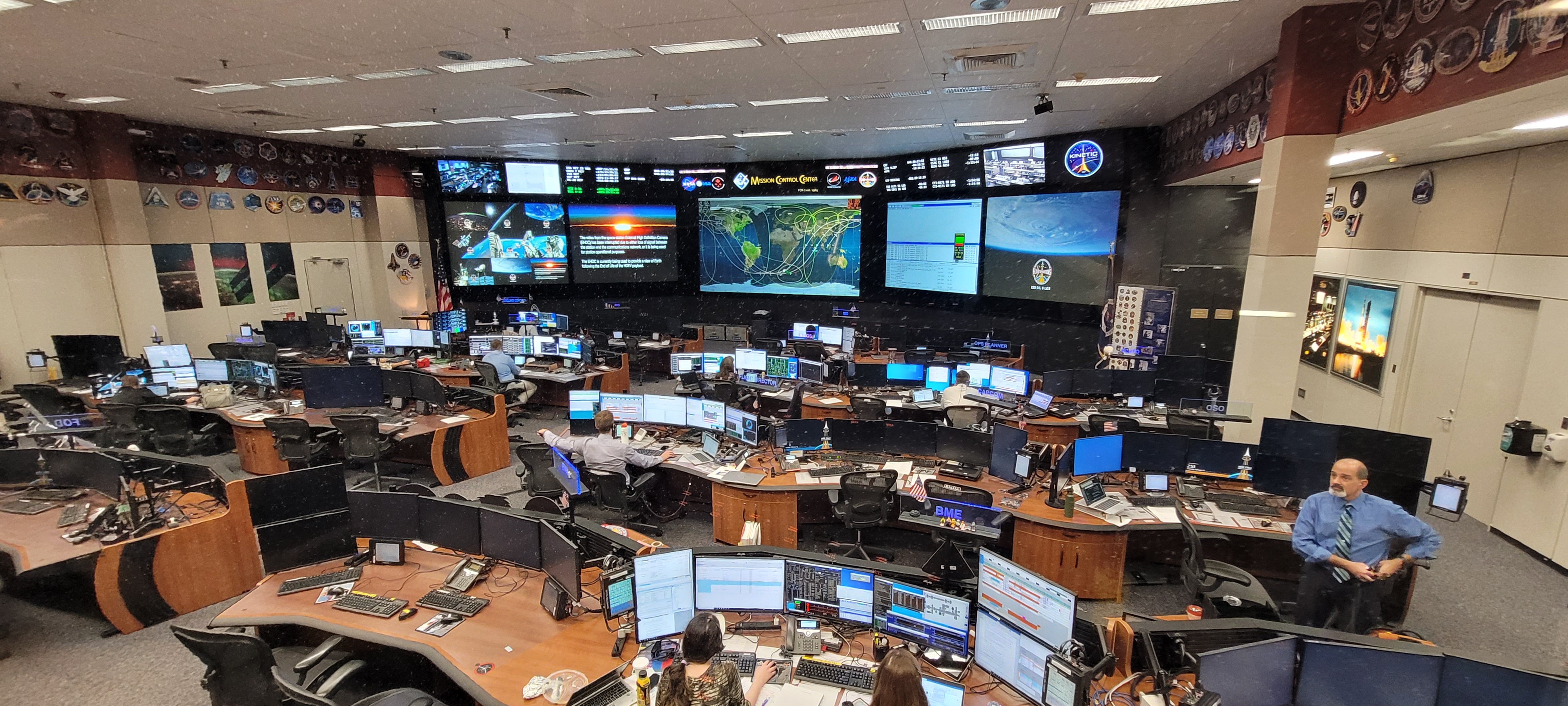 Mission control with many tables and screens