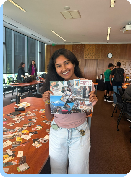 An MHCI student holding her vision board
