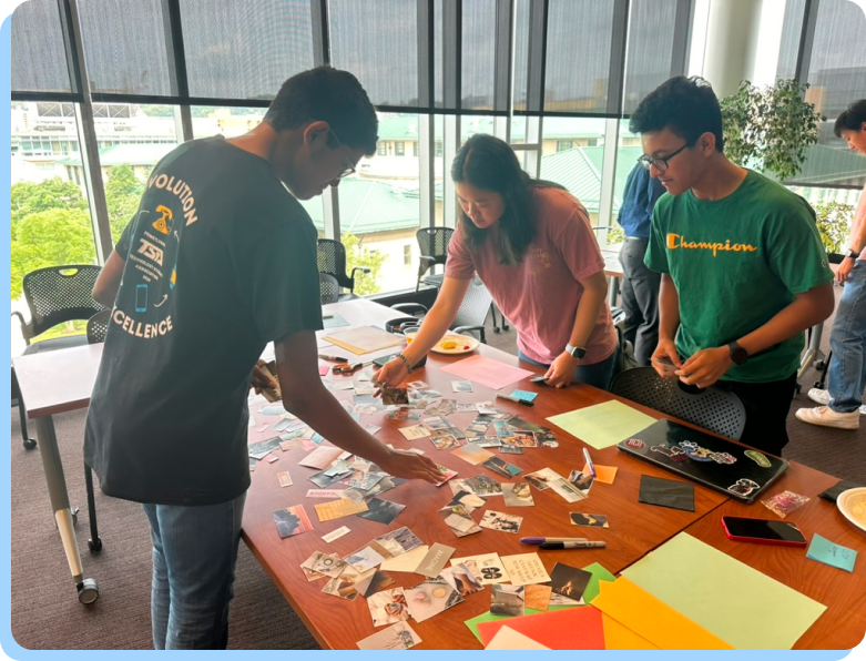 Multiple students working on their vision boards