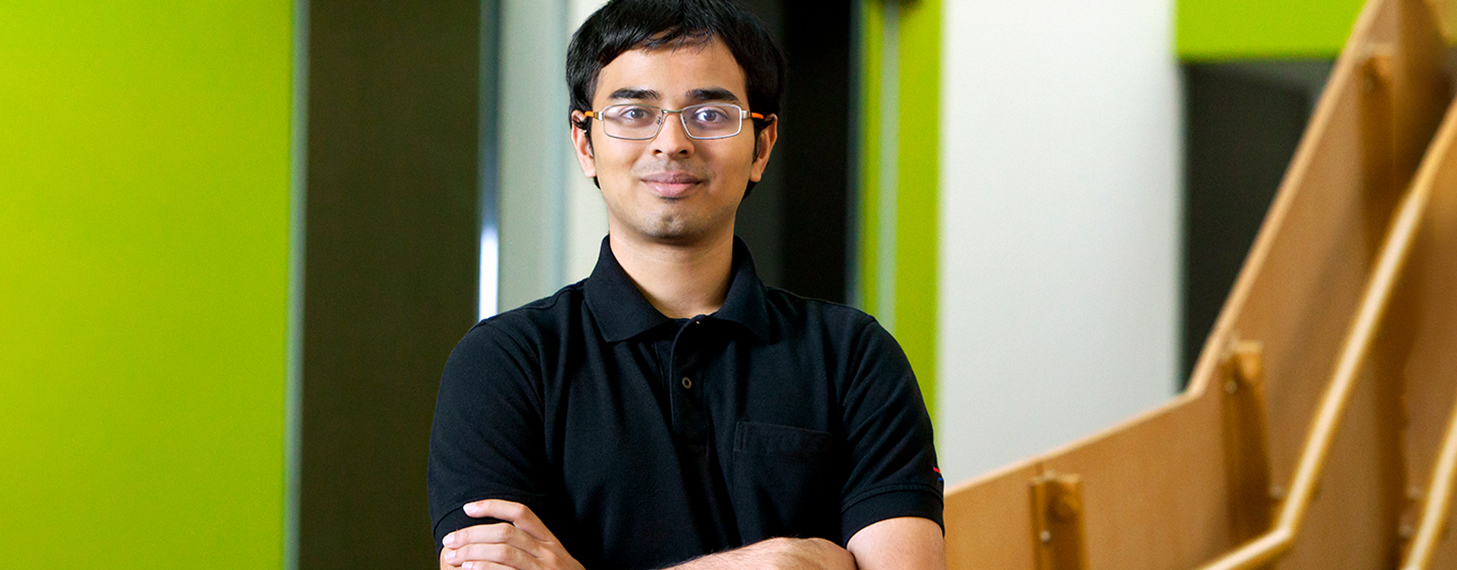 MSPM student standing with arms crossed