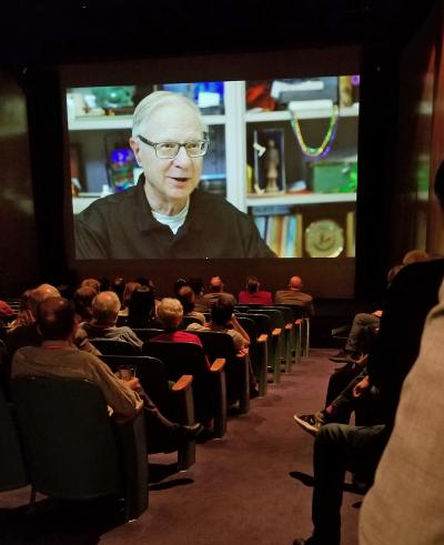 guests watch the HCII retrospective video inside the Warhol auditorium