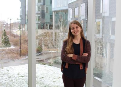 Stephanie Valencia, first year HCII PhD student, stands in the bridge to Gates