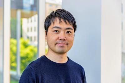 Hirokazu Shirado stands in hallway between Gates and NSH buildings