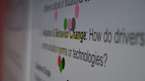 screen with a question prompt and a few colored dots