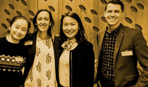 four team members of the Bloomberg student team in sepia tone photo