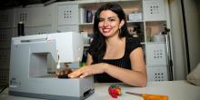 Ashley Burbano uses a sewing machine in the lab