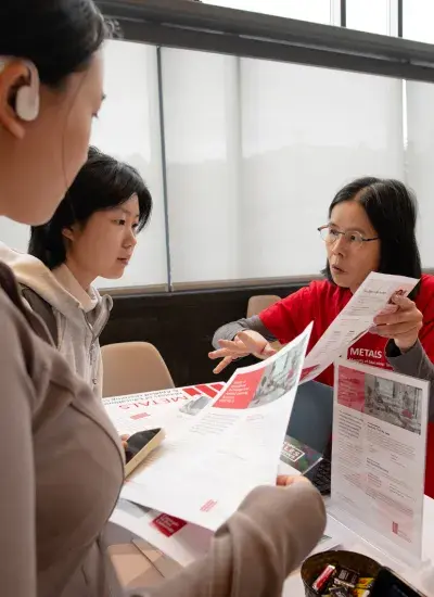 prospective graduate students speak to a program manager at the SCS Grad Fair
