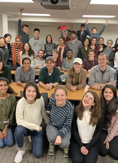 masters students gather for a group photo during class