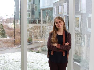Stephanie Valencia, first year HCII PhD student, stands in the bridge to Gates