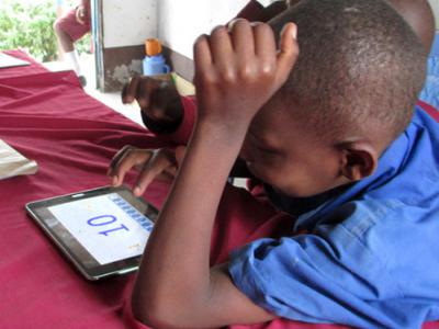 Child interacting with IPad