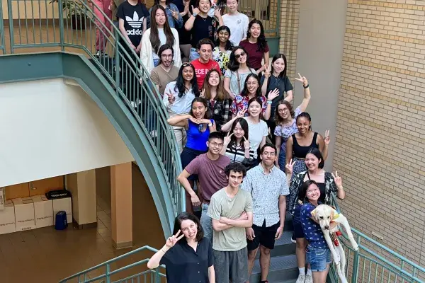 group photo of the 2022 summer researchers on the stairs in the NSH atrium