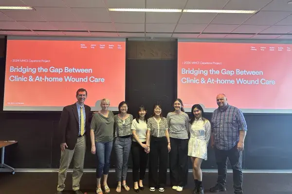 UHC team on presentation day at the front of the classroom