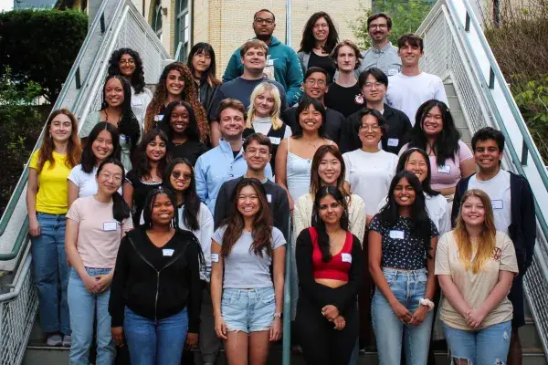 group photo of the summer 2024 researchers standing on a staircase outside