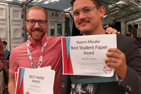 PhD students Madaio and Holstein with their awards at London Festival of Learning