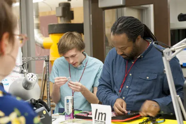 Patrick Carrington and others working at the ChairJam hackathon