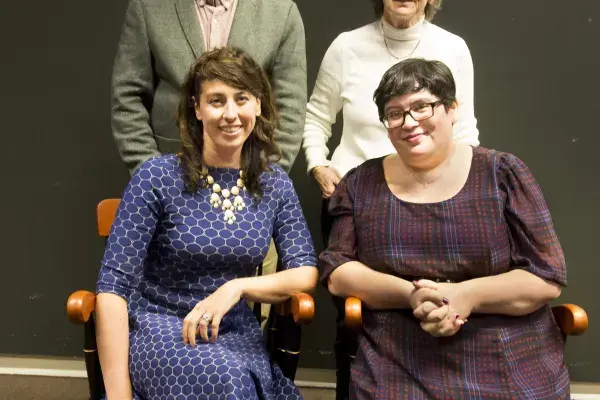 Tom and Lydia Moran stand behind professors Jessica Hammer and Amy Ogan (seated)
